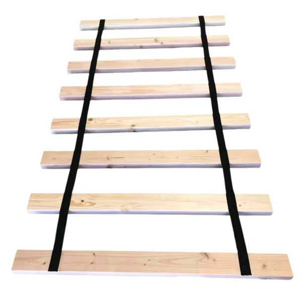 A wooden rail with black straps on it.