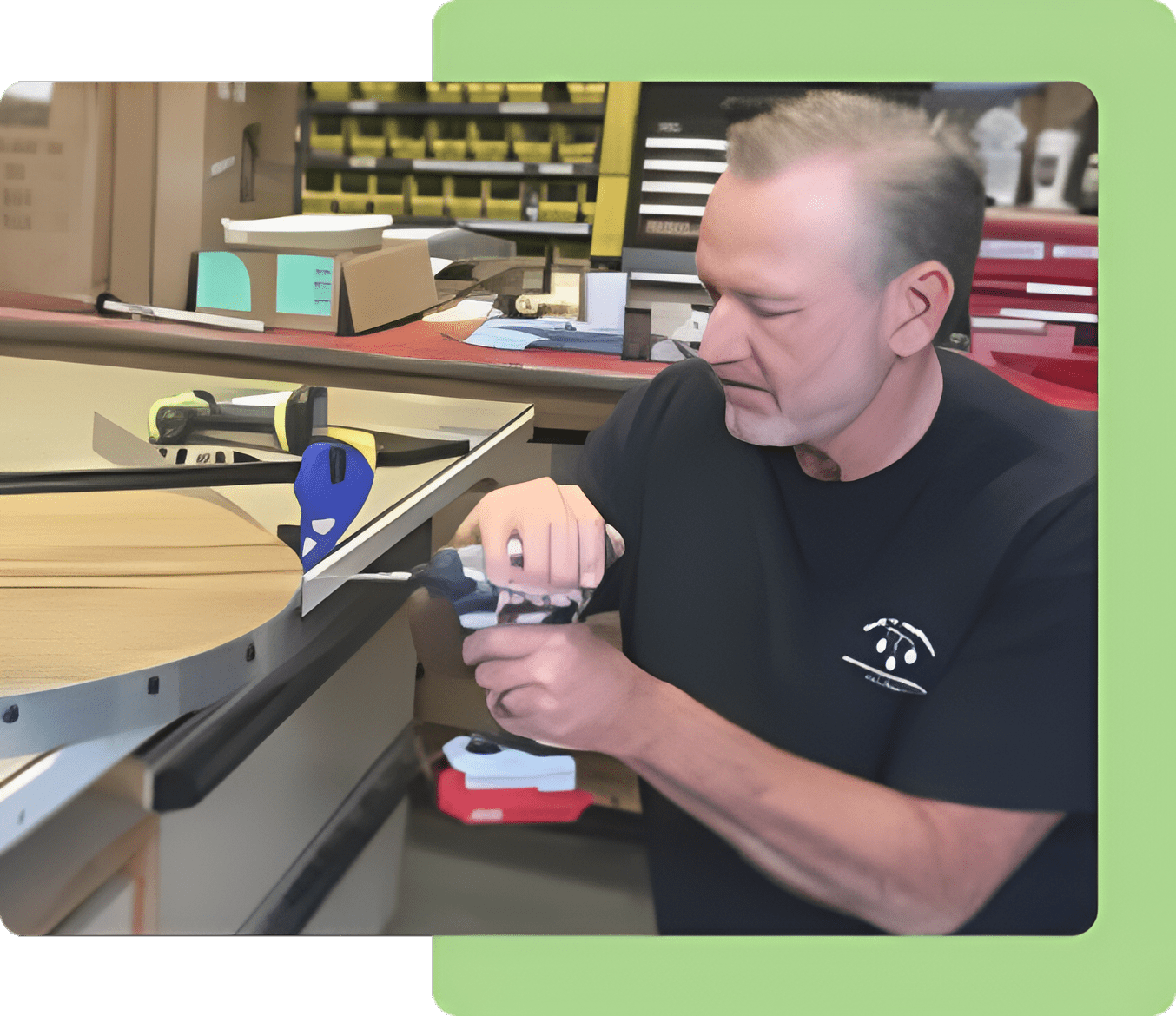 A man working on a piece of wood with a pair of scissors.