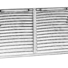 A grill that is sitting on the ground.