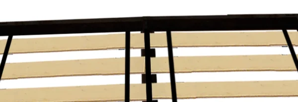 A close up of the slats on a bed frame