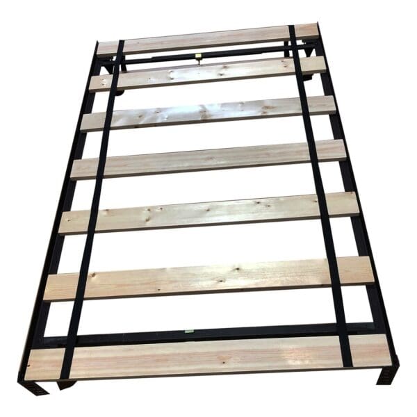 A wooden bed frame with metal bars on top.