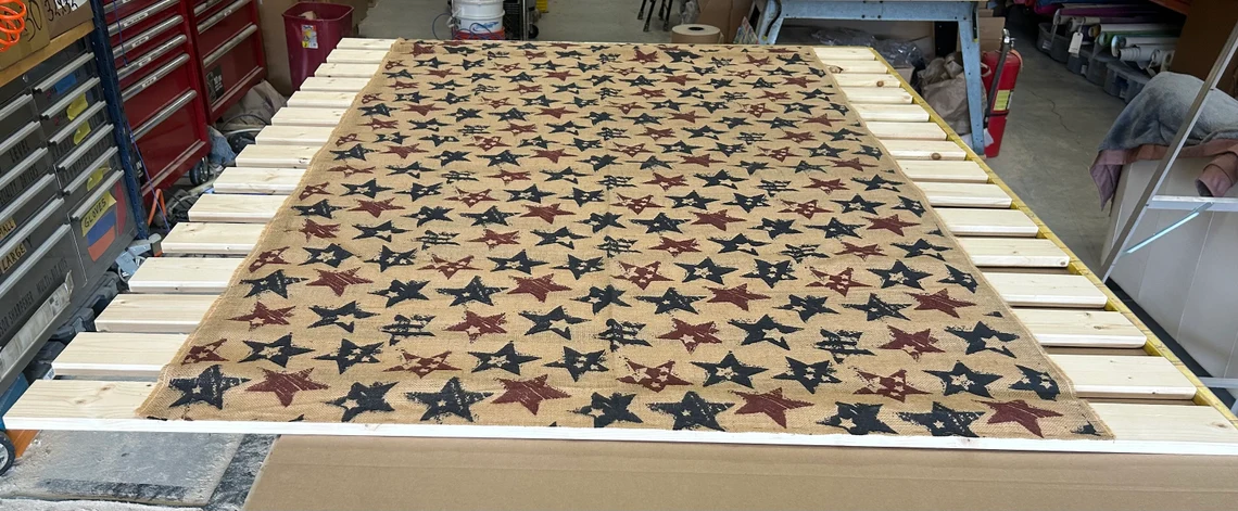 A table with a blanket covered in stars.