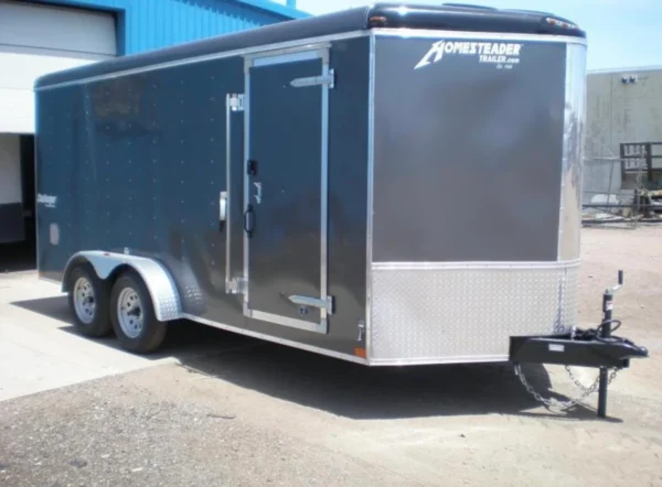 A trailer that is parked in the street.