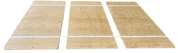 A wooden board with white tape on it.