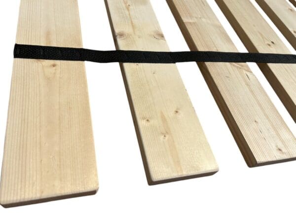 A close up of the wood planks on top of a table.