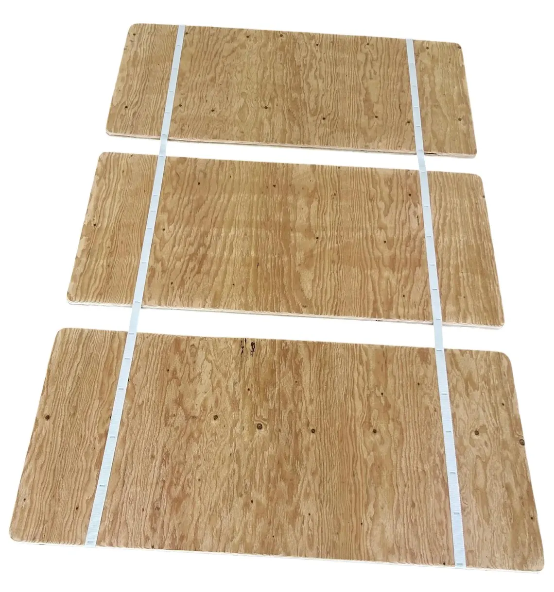 A set of three wooden boards with white lines on them.