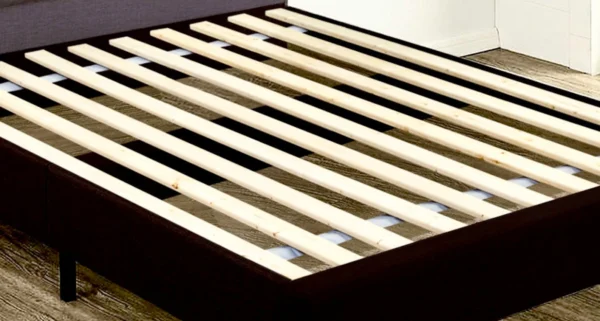 A close up of the slats on a bed