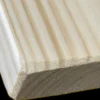A close up of the edge of a wooden board