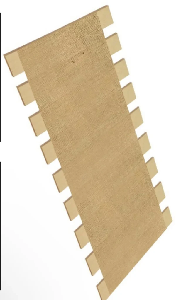 A piece of cardboard with a strip of paper on it.