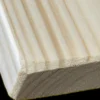 A close up of the edge of a wooden board