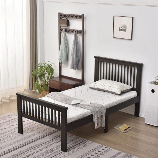 A bed room with a wooden frame and mattress