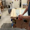 A man is working on a project in the shop.