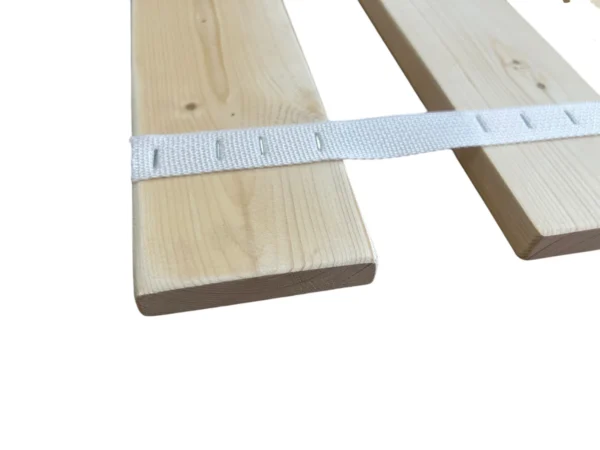 A wooden board with tape on it