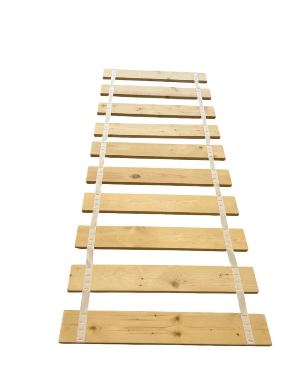 A wooden ladder with white tape on it.