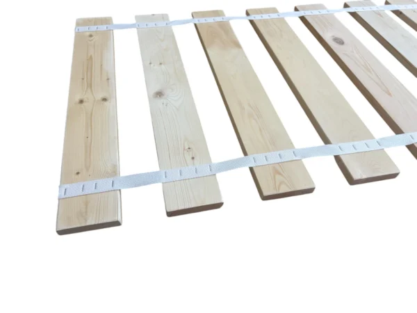 A bed frame with wooden slats and white tape.