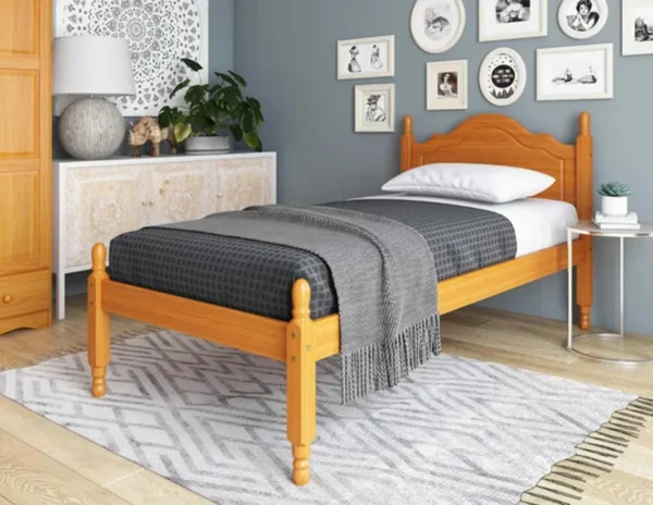 A bed with a wooden headboard and footboard.