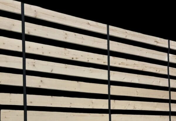 A close up of some wooden slats on the side of a building