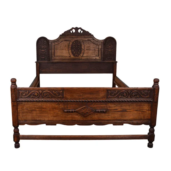 A bed frame with an ornate headboard and footboard.