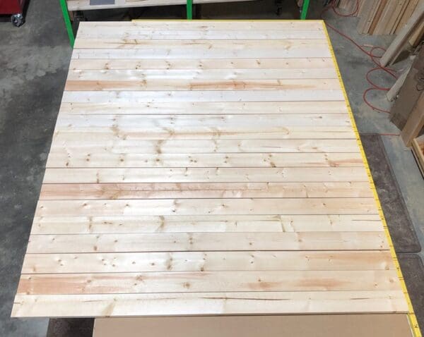 A wooden table with many boards on it