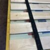 A wooden board with some black and blue tape