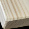 A close up of the wood grain on a piece of wood.