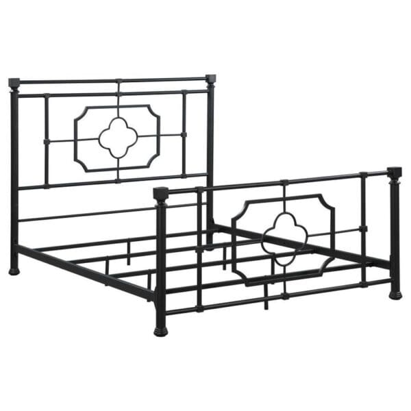 A black metal bed frame with a decorative headboard.