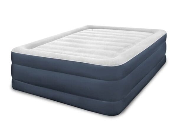 A blue and white mattress with an air bed on top.