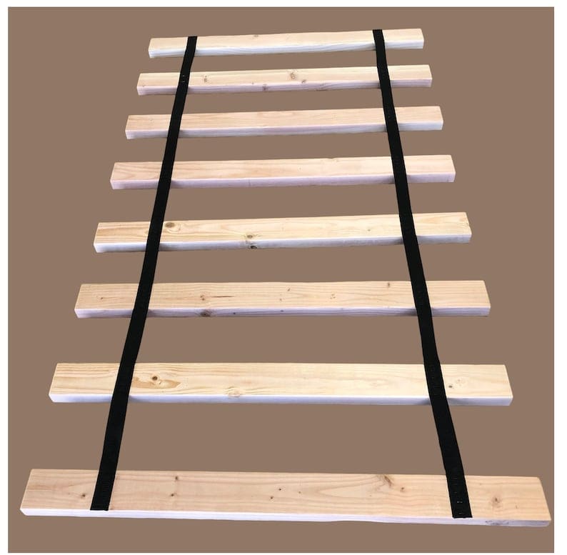 A wooden rail with black straps on it.