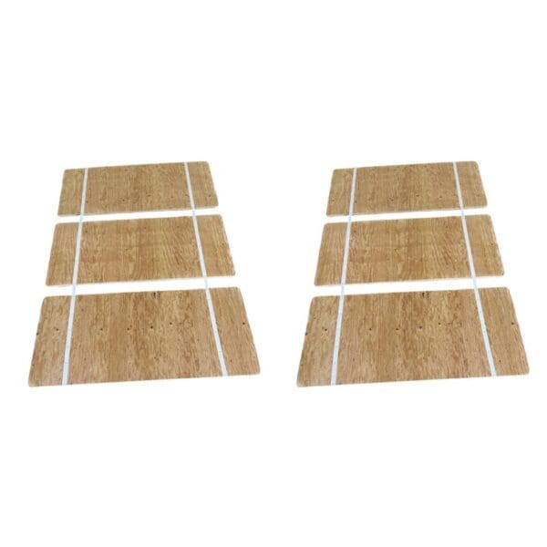 A set of four wooden boards with white lines.